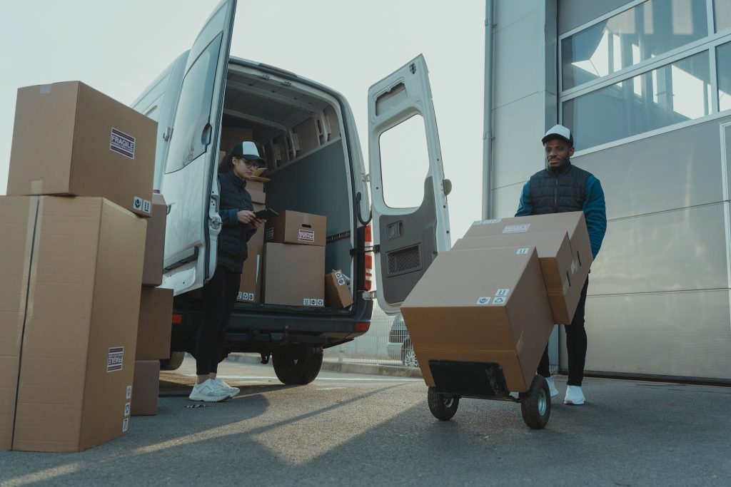 Veddys, A Man and a Woman Working for a Delivery Company