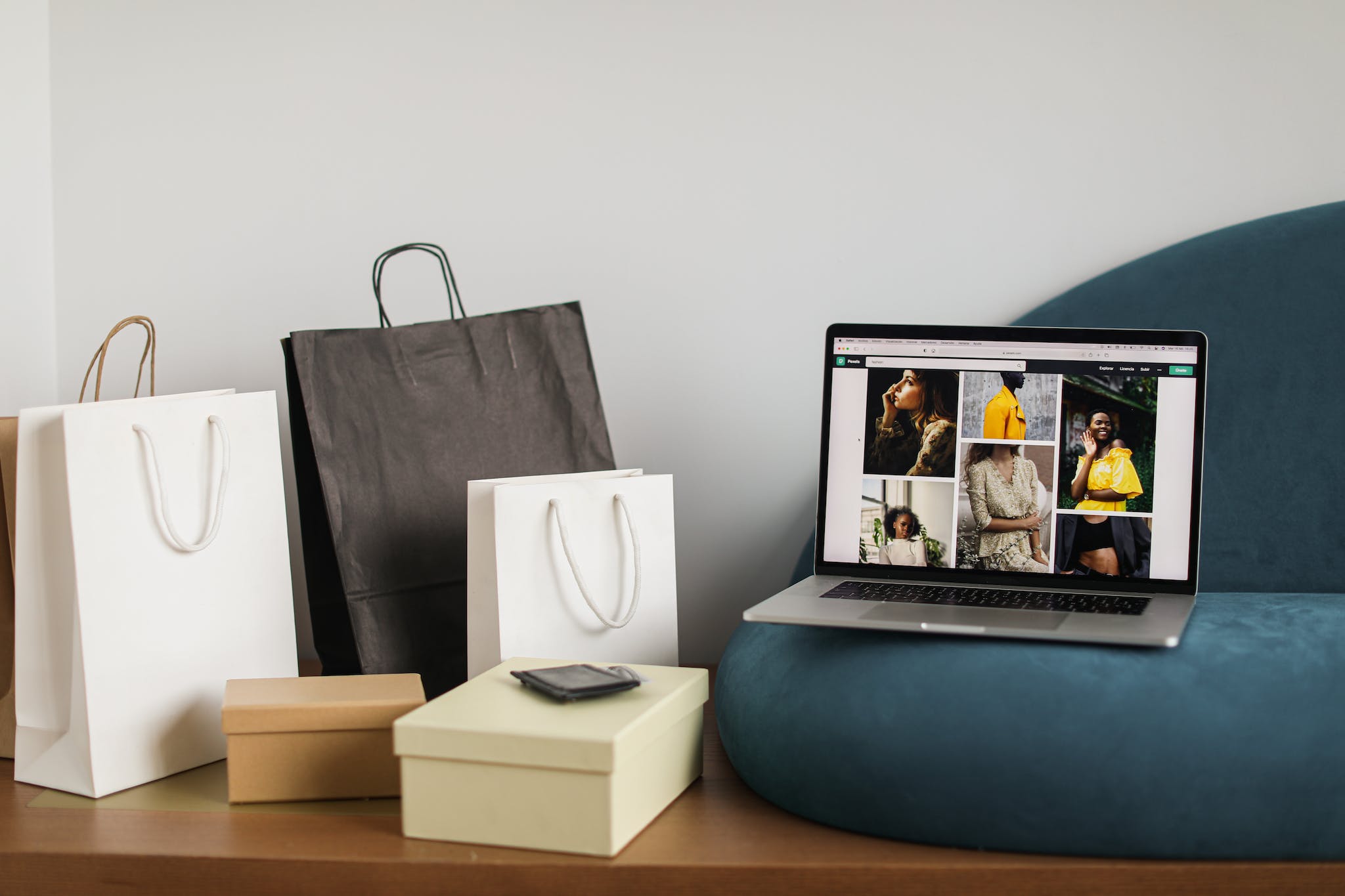 Veddys, Shopping Bags Beside a Laptop
