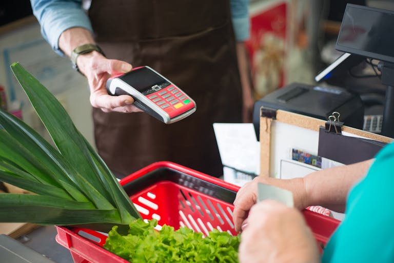 Veddys, A Shopper Paying at the Counter
